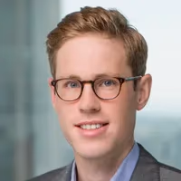 Lawyer reviewing contract with AI assistance